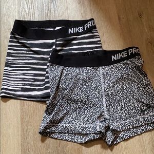 Two pairs of Nike Pros